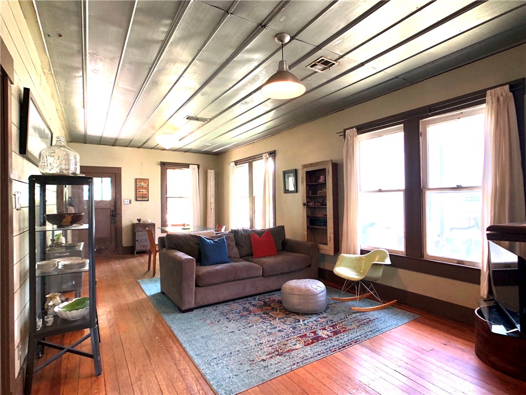 1008 Willow Street Austin, TX 78702 - Photo 1 of 1 a living room with furniture and a large window