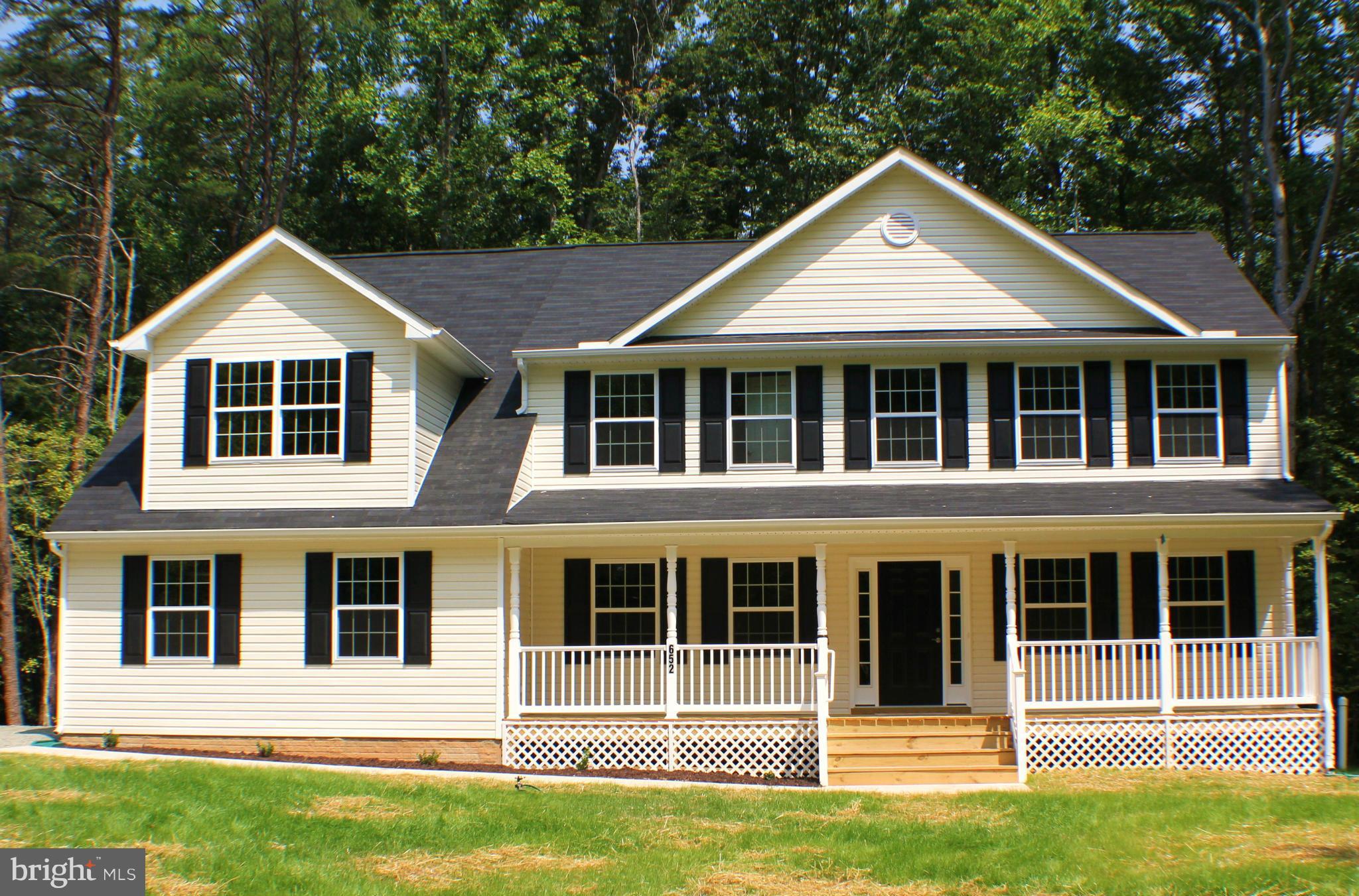 652 West Rocky Run Road Fredericksburg, VA 22406 - Photo 1 of 20 a front view of a house with a yard