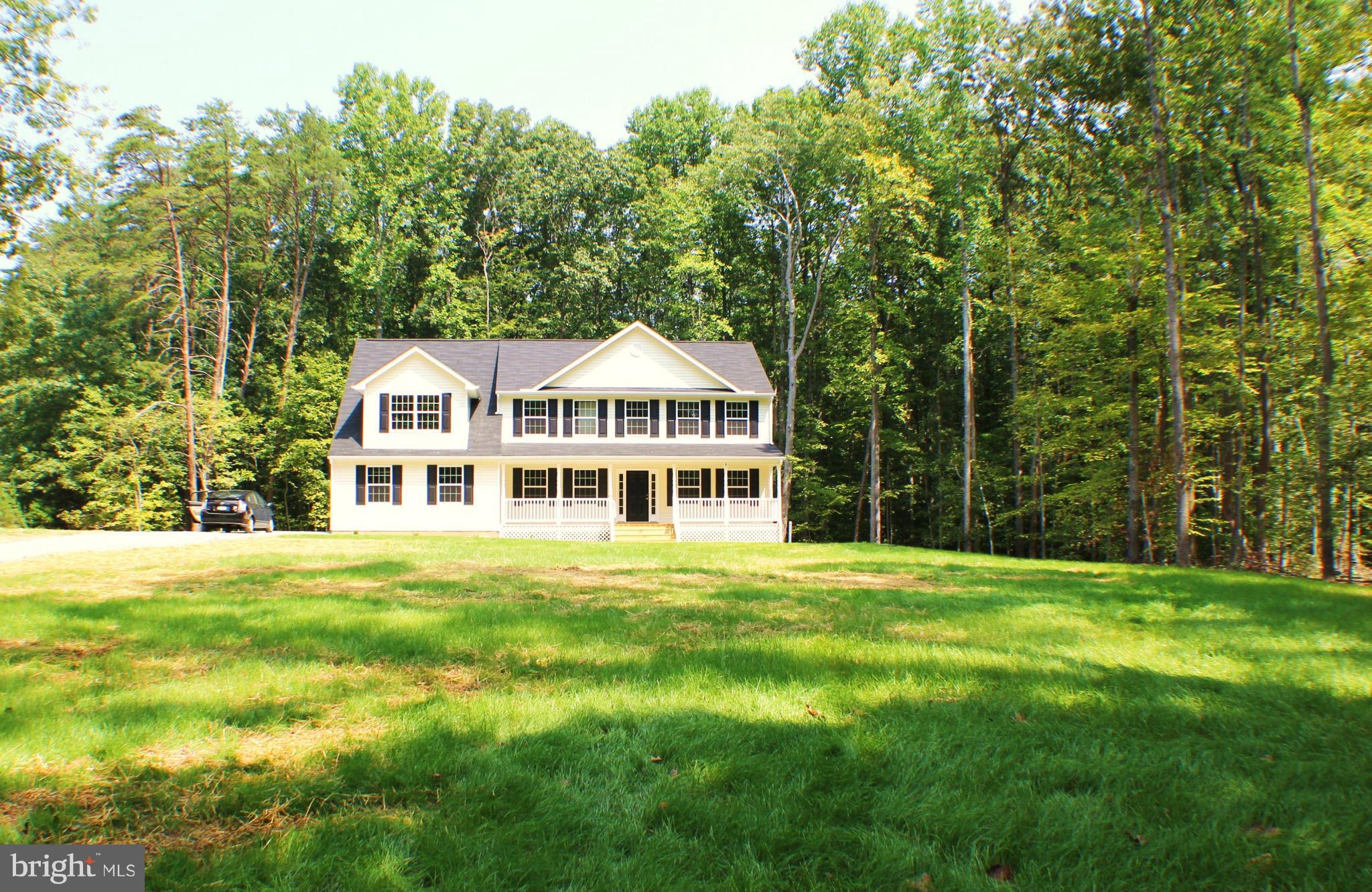 652 West Rocky Run Road Fredericksburg, VA 22406 - Photo 2 of 20 a front view of a house with a garden