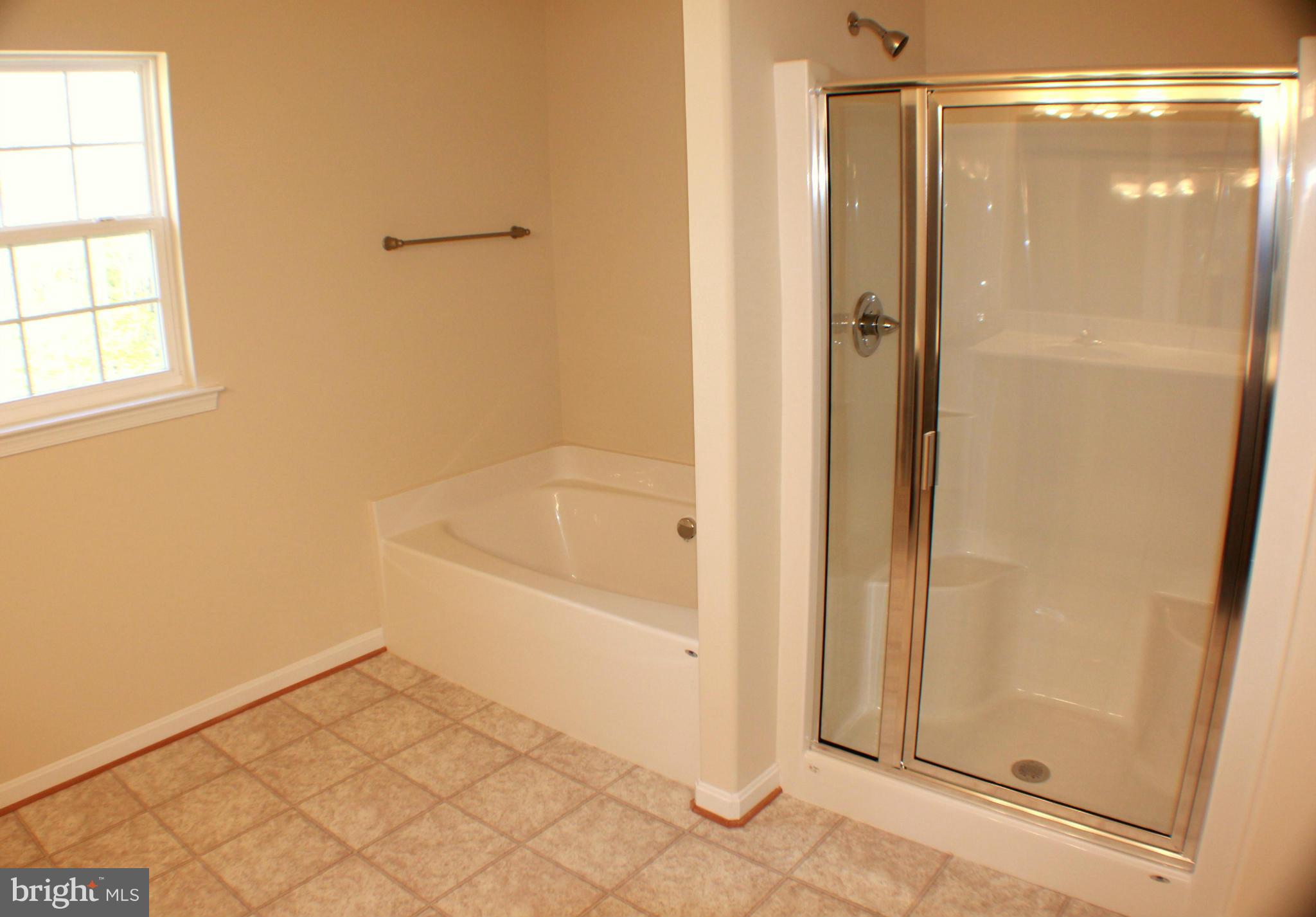 652 West Rocky Run Road Fredericksburg, VA 22406 - Photo 15 of 20 a bathroom with a bathtub and shower