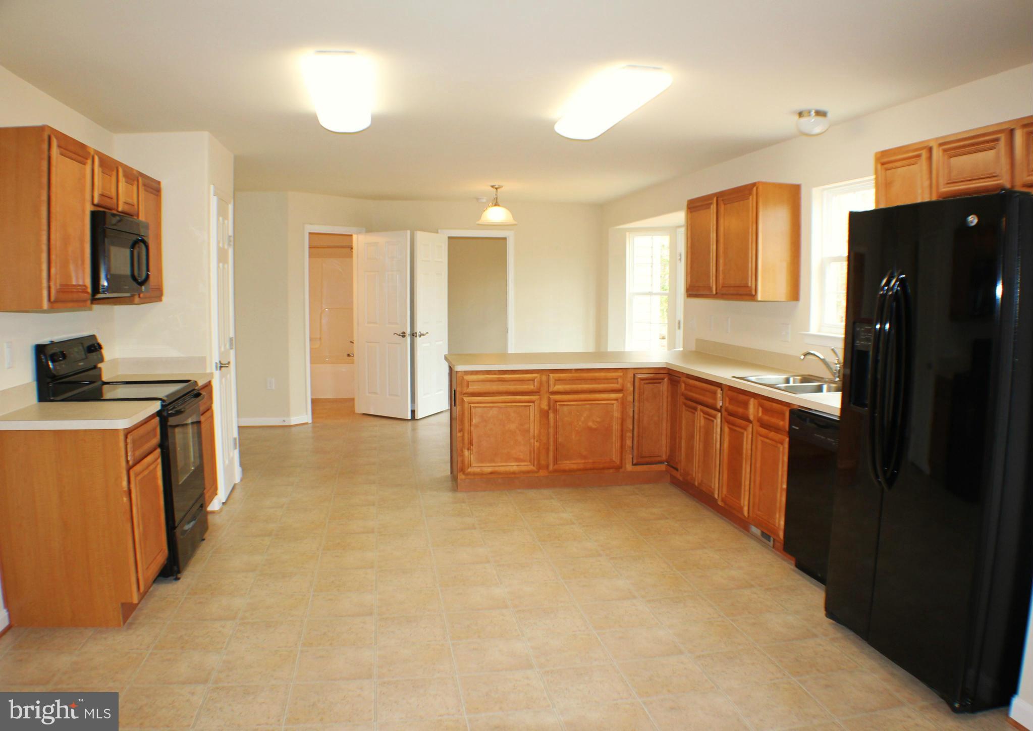 652 West Rocky Run Road Fredericksburg, VA 22406 - Photo 6 of 20 a kitchen with stainless steel appliances granite countertop a refrigerator and a sink