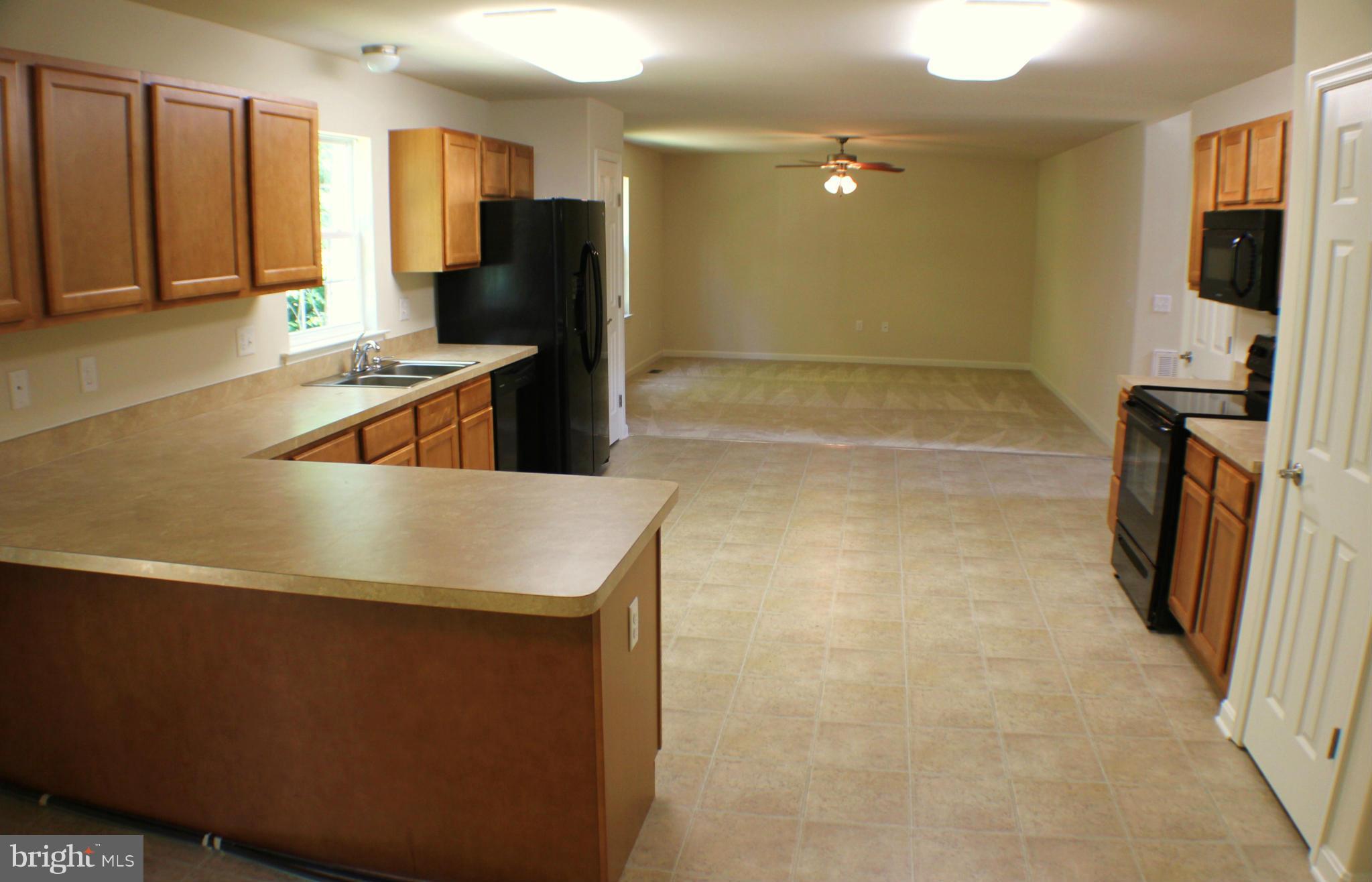 652 West Rocky Run Road Fredericksburg, VA 22406 - Photo 9 of 20 a kitchen with stainless steel appliances a refrigerator and a stove
