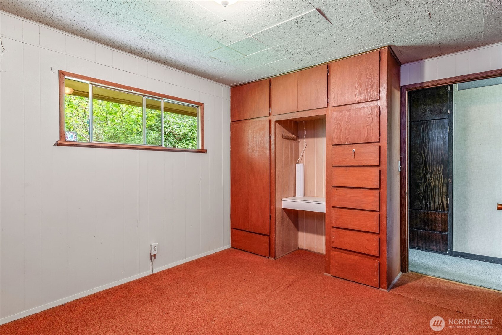 1310 East Quilcene Road Quilcene, WA 98376 - Photo 27 of 37 an empty room with wooden floor and windows