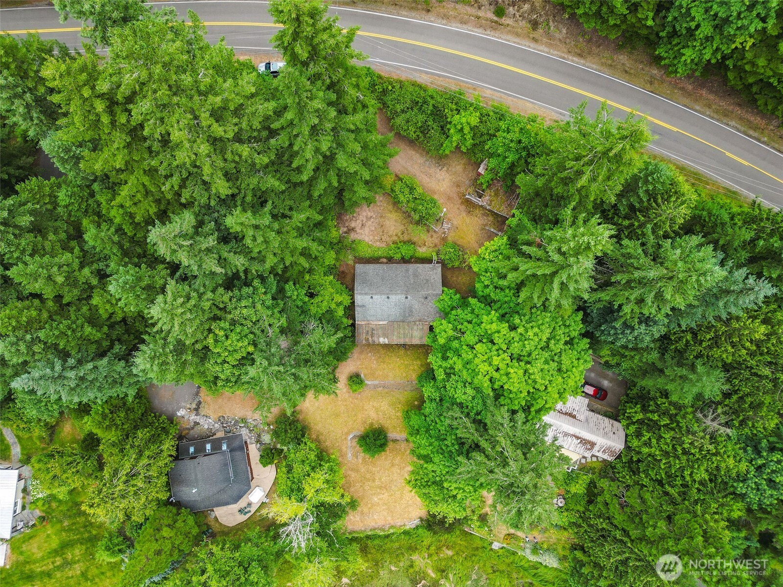 1310 East Quilcene Road Quilcene, WA 98376 - Photo 3 of 37 an aerial view of a house with a yard