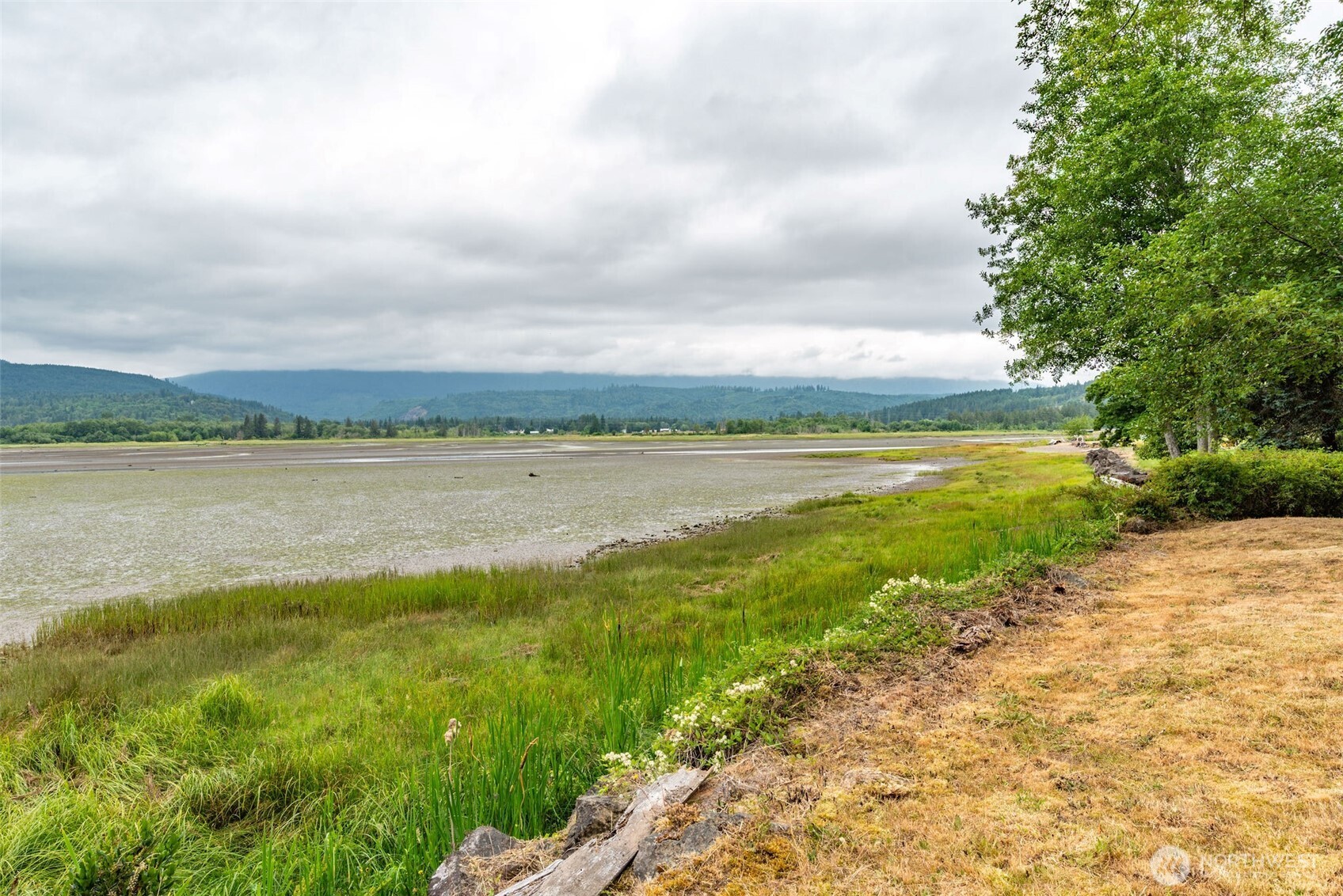 1310 East Quilcene Road Quilcene, WA 98376 - Photo 36 of 37 a view of a lake with a big yard