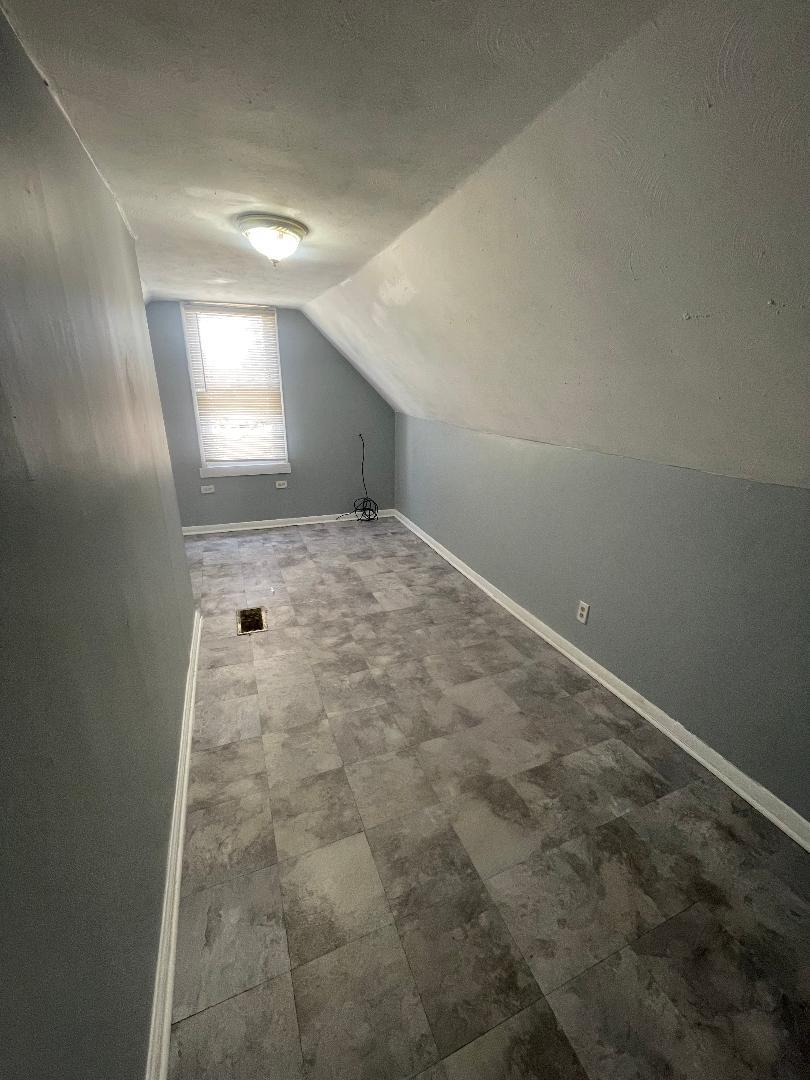 8136 South Exchange Avenue, Unit 2 Chicago, IL 60617 - Photo 6 of 8 a view of an empty room