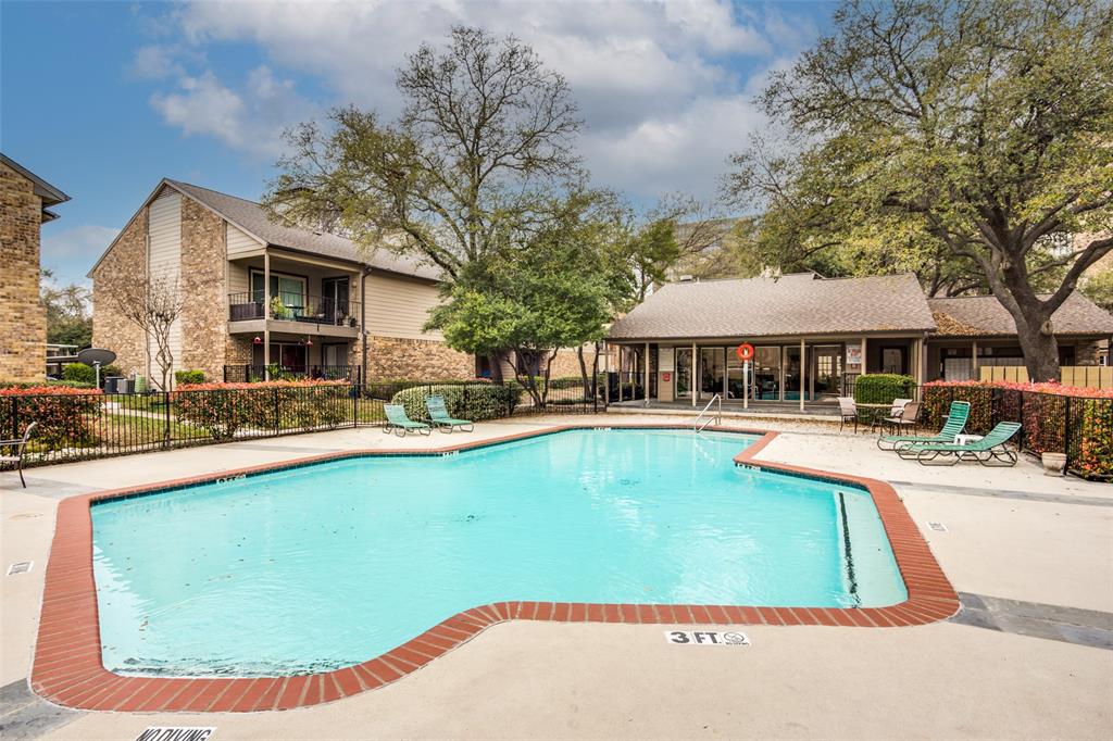 a view of a house with swimming pool and sitting area