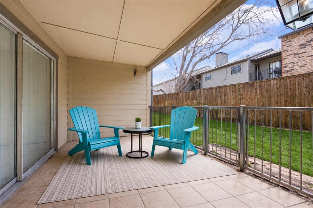 5300 Keller Springs Road, Unit 1067 Dallas, TX 75248 - Photo 13 of 14 a view of a chair and tables in the balcony