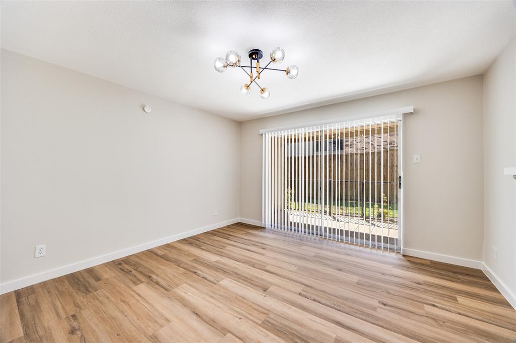 5300 Keller Springs Road, Unit 1067 Dallas, TX 75248 - Photo 4 of 14 a view of a room with wooden floor