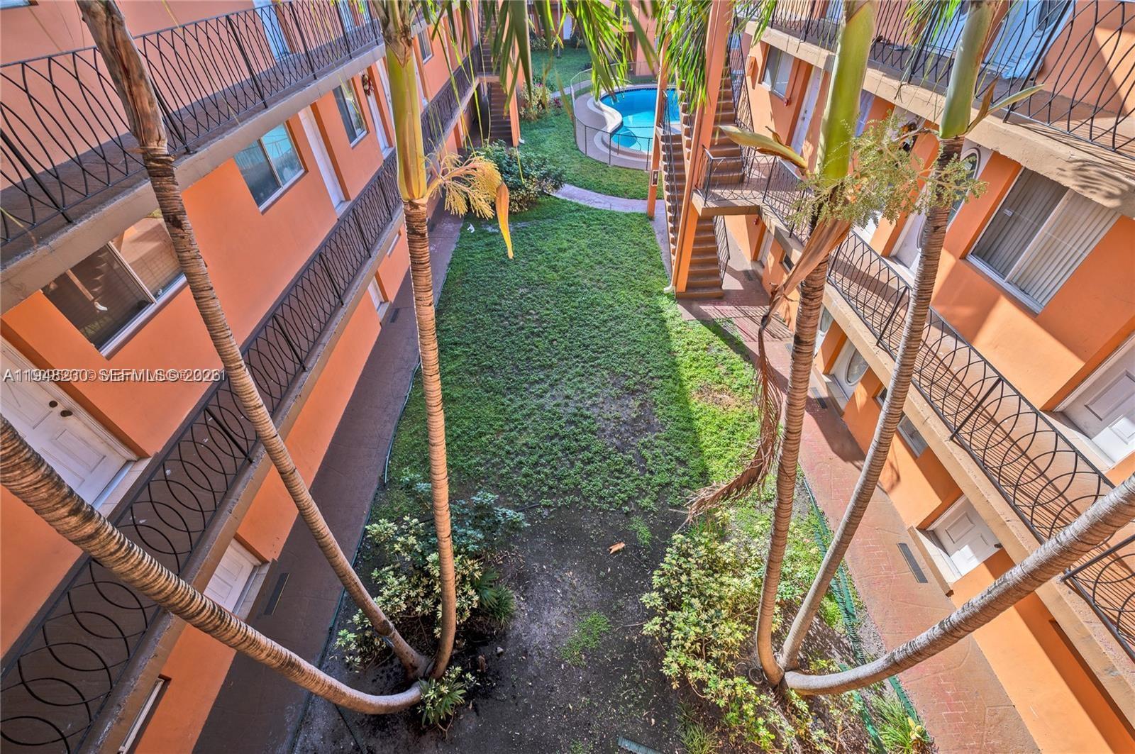 2330 Northwest 11th Street, Unit 9 Miami, FL 33125 - Photo 1 of 18 front view of a house with a yard