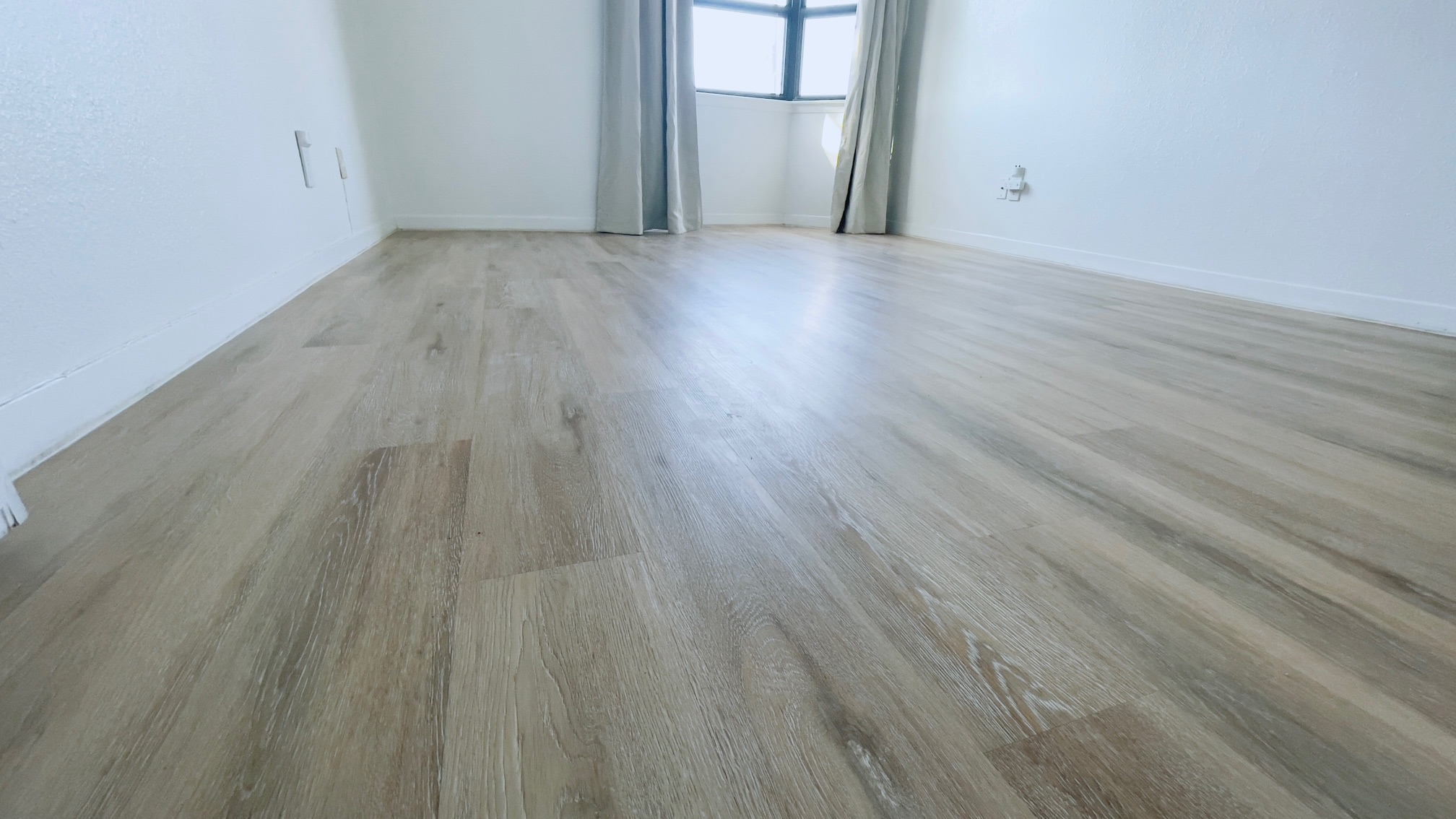 1510 West N Loop Boulevard, Unit 822 Austin, TX 78756 - Photo 10 of 12 Spare room featuring light wood-type flooring and baseboards