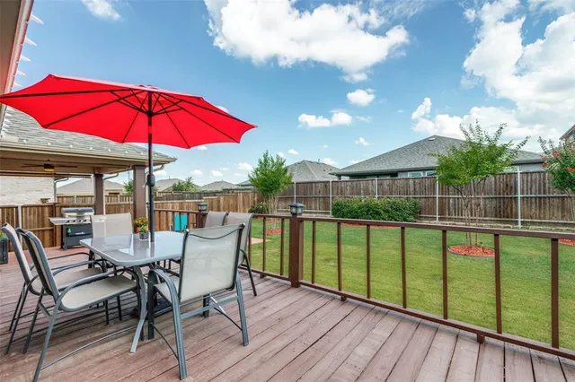 a view of a chair and tables in the balcony