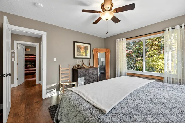 a bed room with a bed and a chandelier