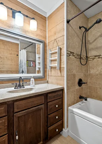 a bathroom with a sink a vanity and a mirror