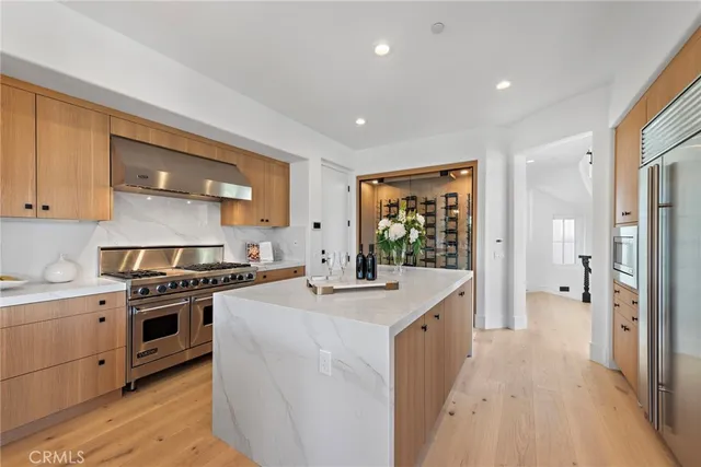 a kitchen with a stove a sink and a refrigerator