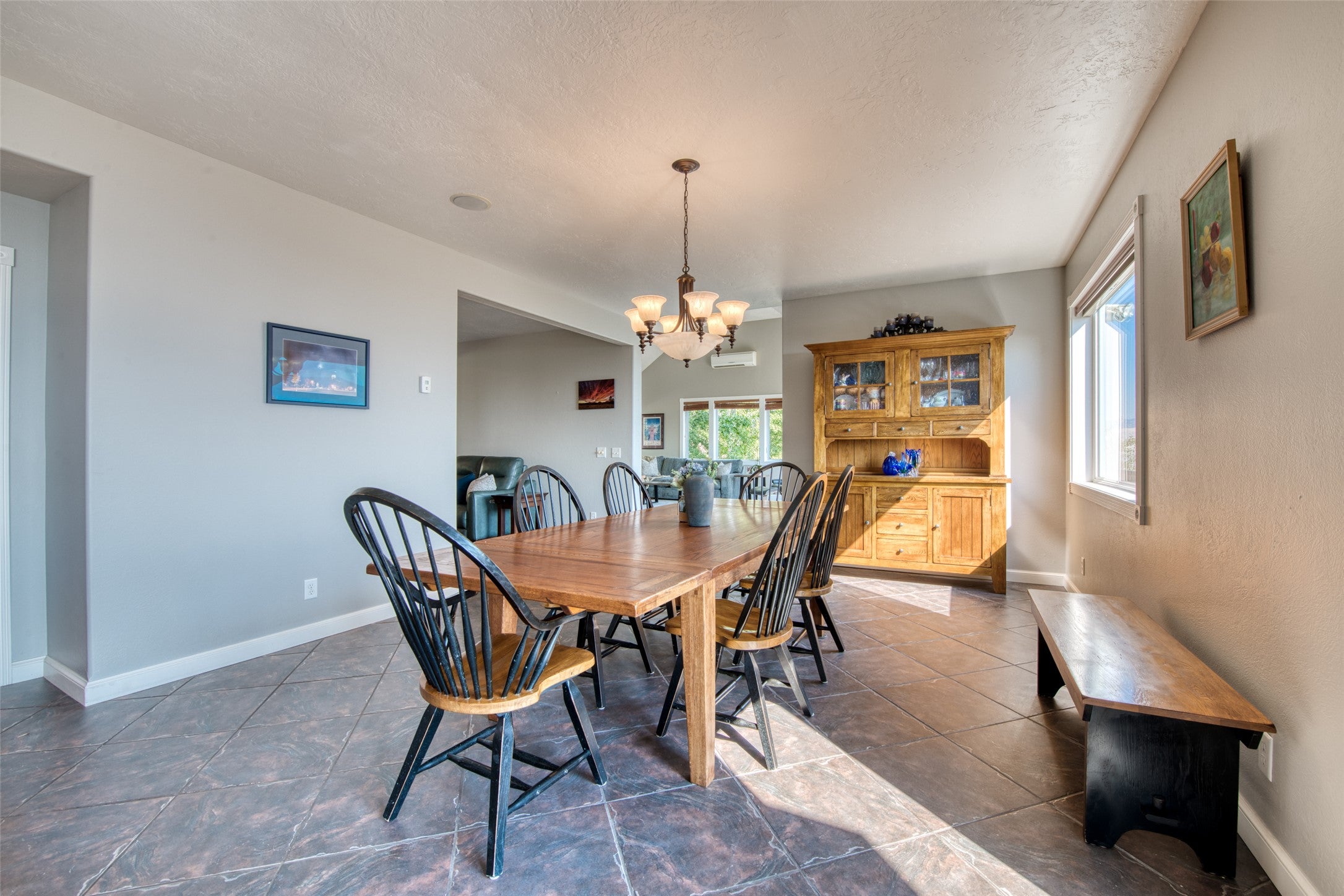 16374 Folsom Road Florence, MT 59833 - Photo 34 of 98 Dining area with plenty of natural light, a chandelier, and dark tile patterned floors