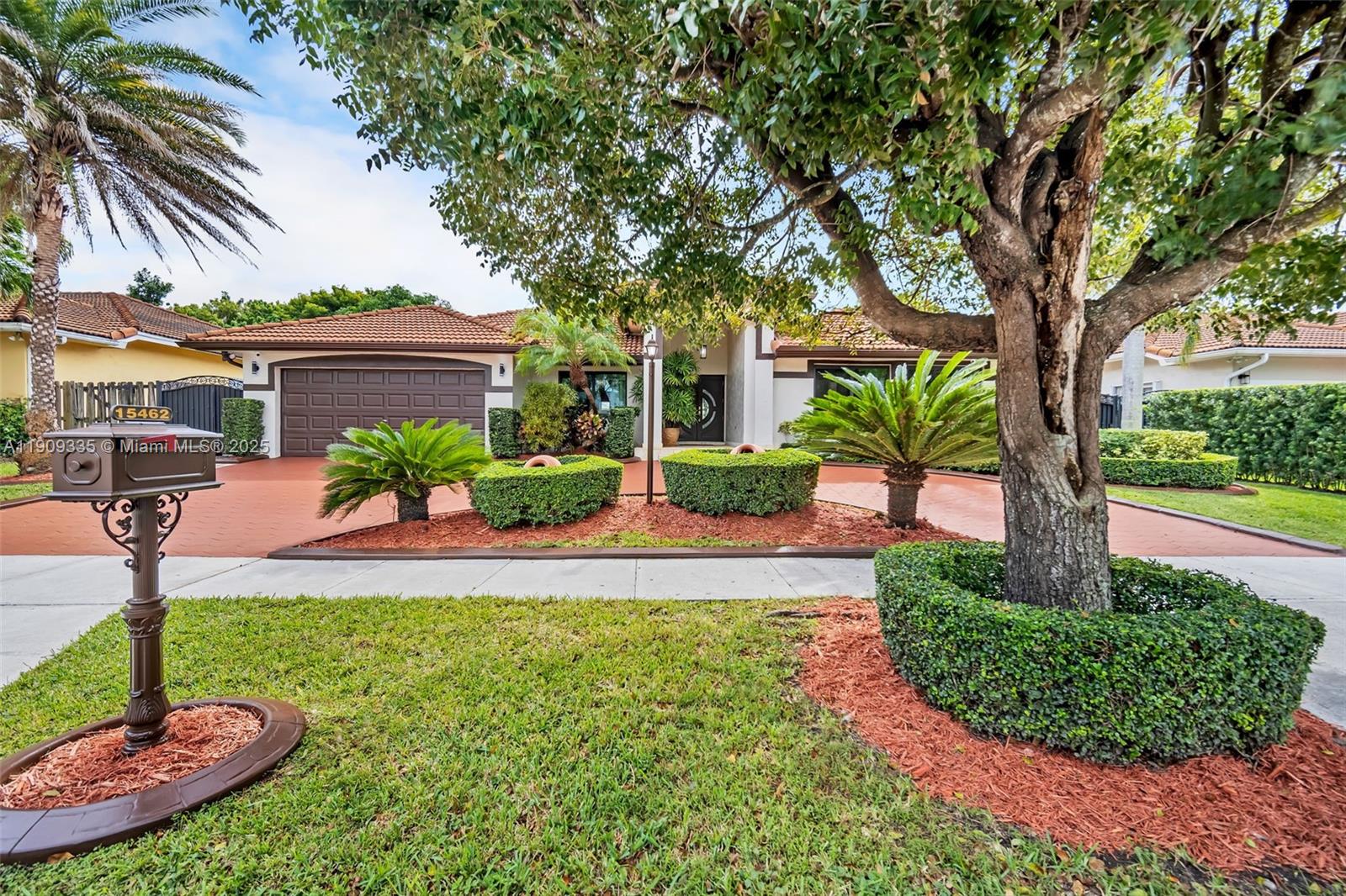 a front view of a house with garden