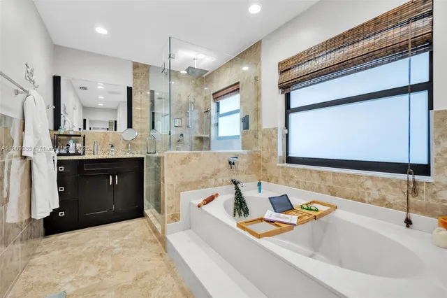 a bathroom with a granite countertop sink a toilet and a mirror