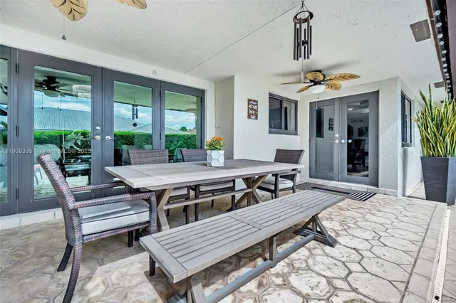 a view of swimming pool with outdoor seating