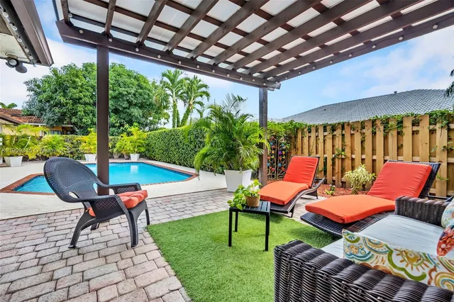 a potted plant sitting in front of a door