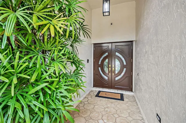 a view of front door with washer and dryer