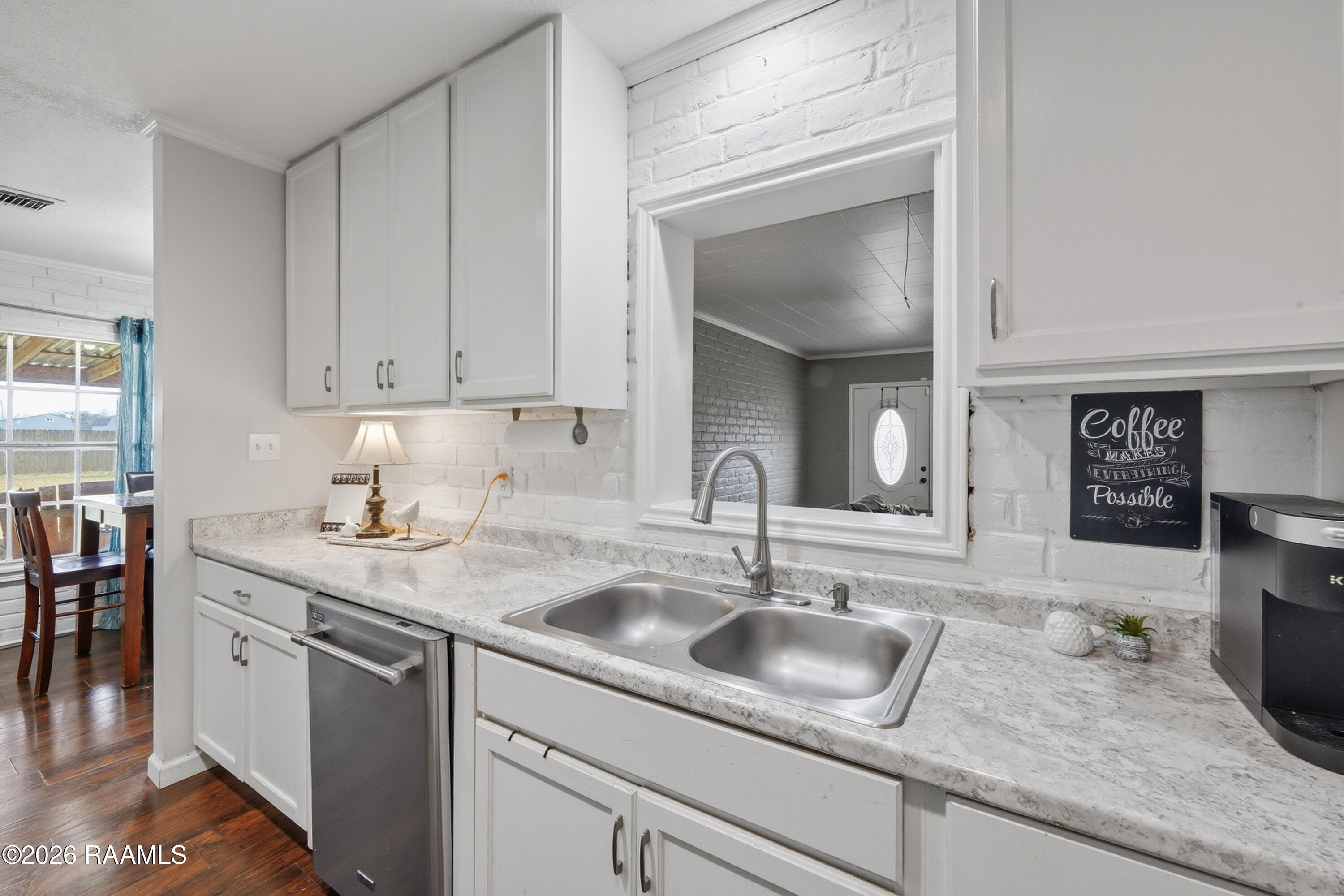 218 Fallis Road Lafayette, LA 70507 - Photo 11 of 23 Fallis Kitchen has a pass through to bon