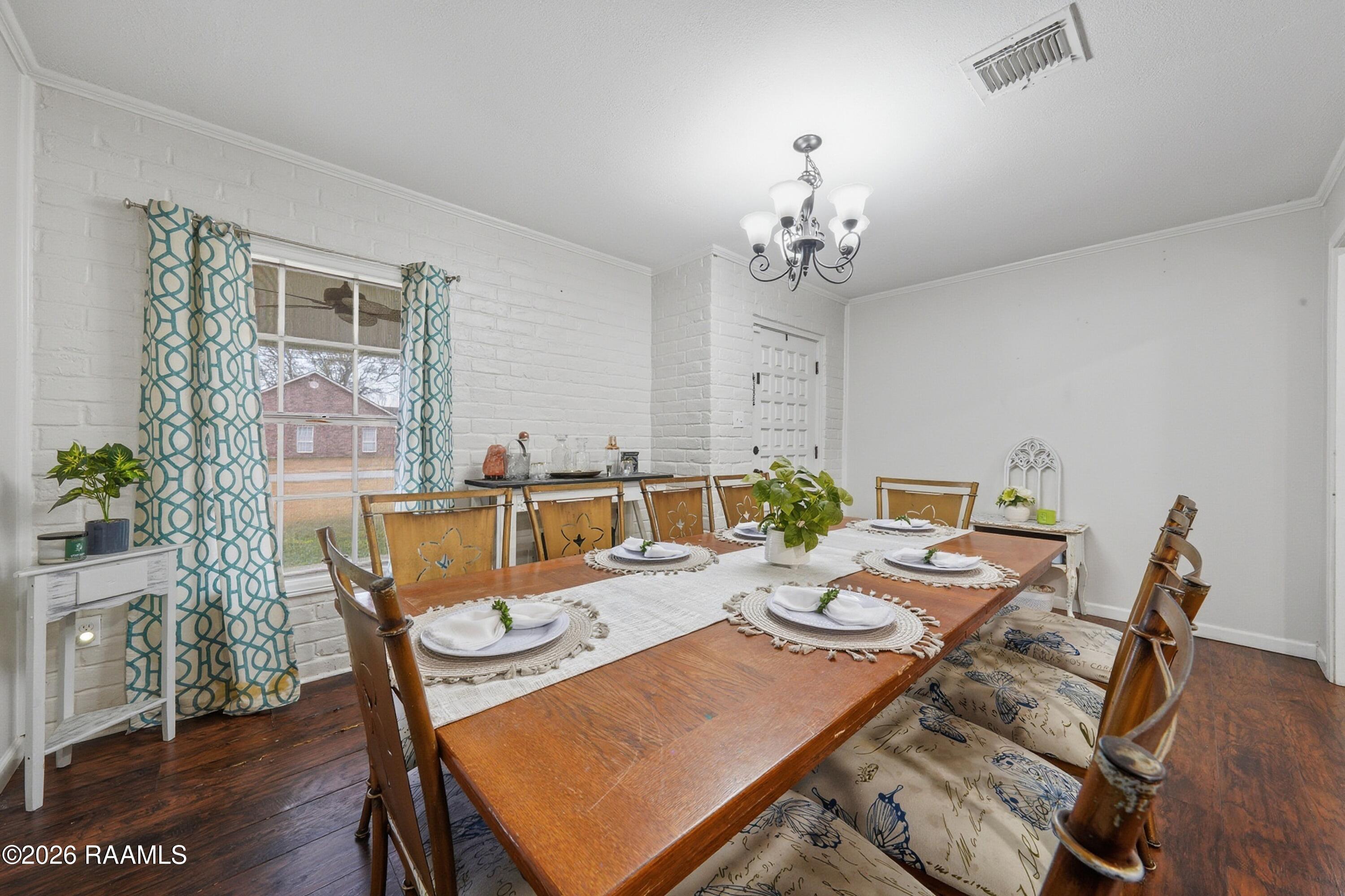 218 Fallis Road Lafayette, LA 70507 - Photo 3 of 23 Fallis dining room and front door