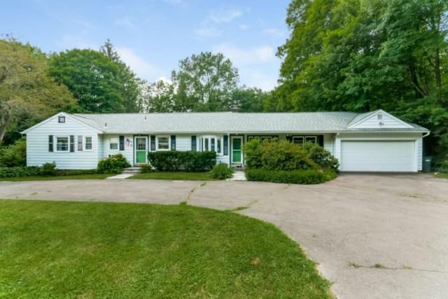 8 Fieldstone Road Brookfield, CT 06804 - Photo 1 of 1 a front view of a house with a yard and garage