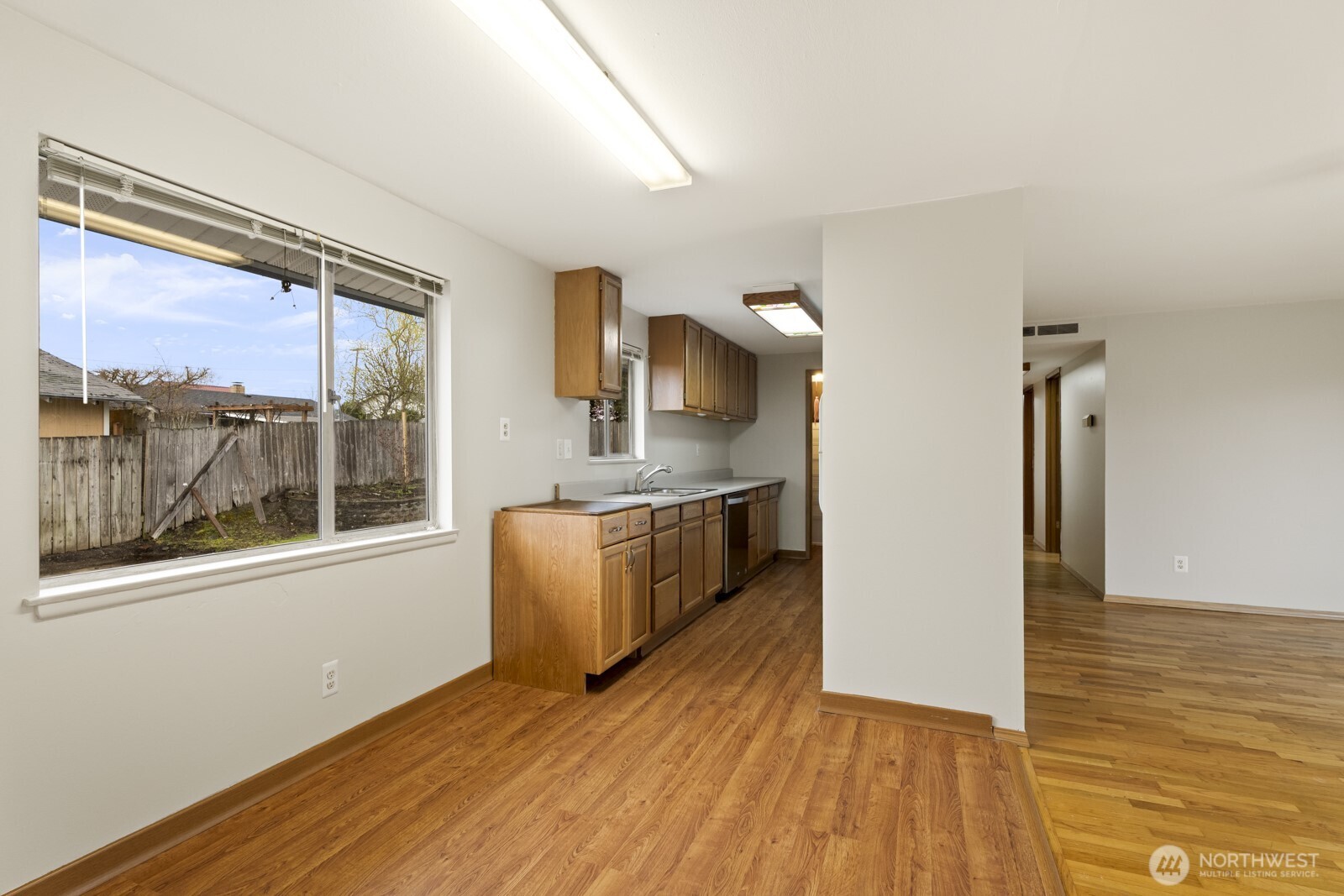 12742 Southeast 171st Place Renton, WA 98058 - Photo 16 of 33 a view of kitchen with wooden floor