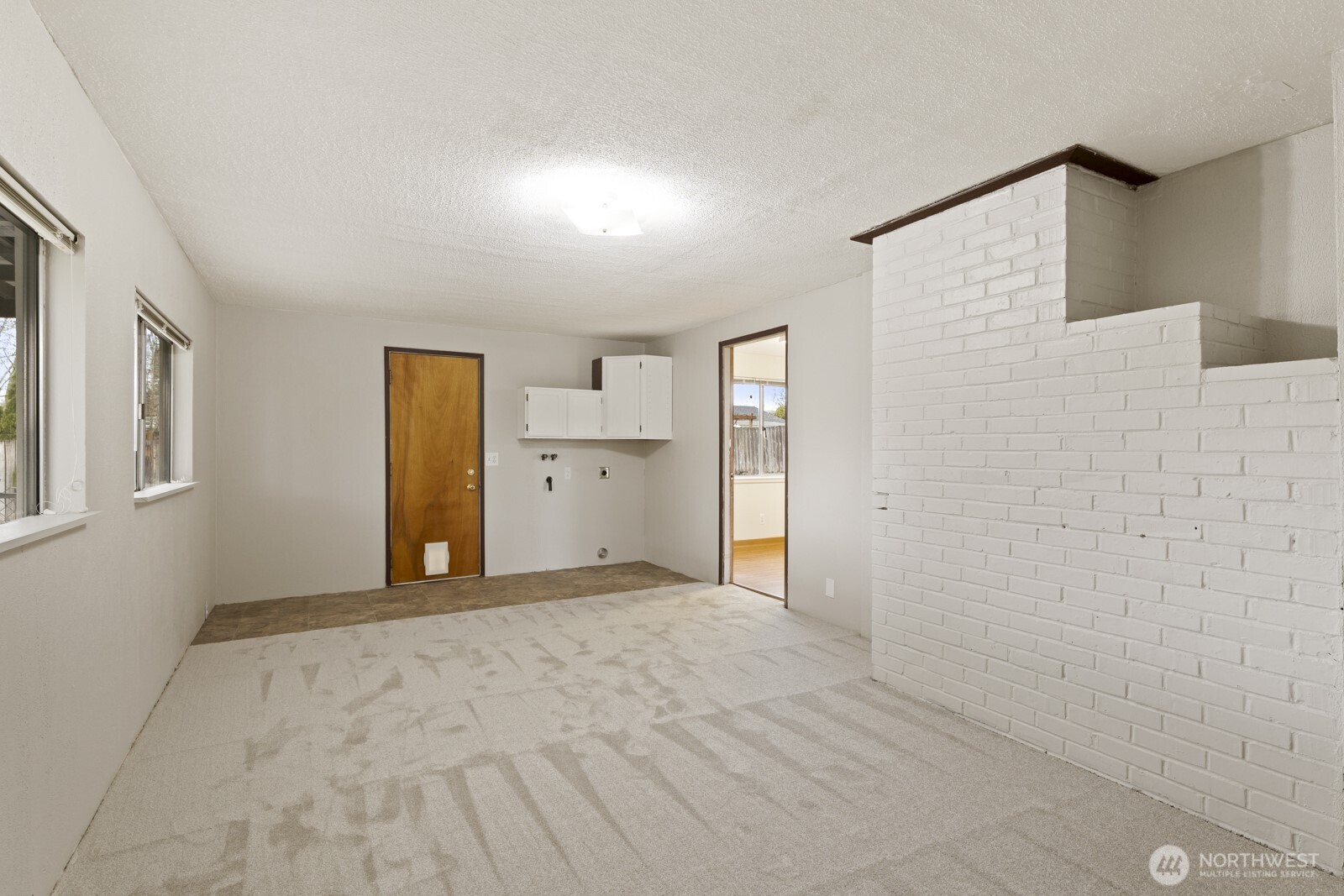 12742 Southeast 171st Place Renton, WA 98058 - Photo 19 of 33 a view of empty room with a fireplace