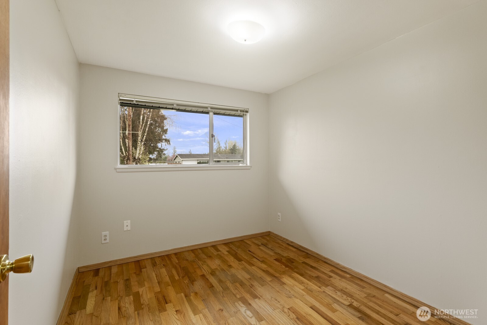 12742 Southeast 171st Place Renton, WA 98058 - Photo 20 of 33 a view of a room with wooden floor and bench