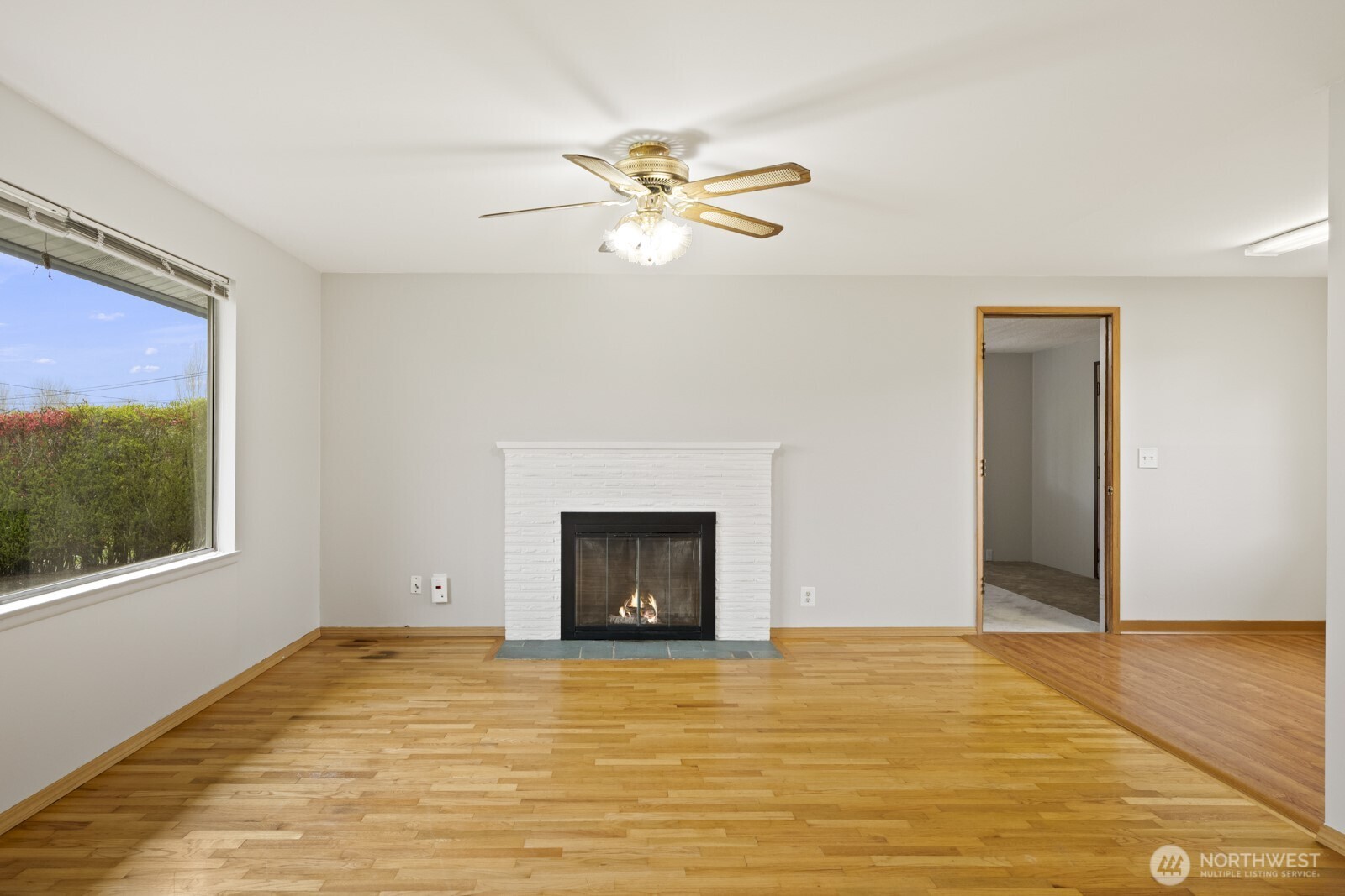 12742 Southeast 171st Place Renton, WA 98058 - Photo 25 of 33 a view of empty room with window and ceiling fan