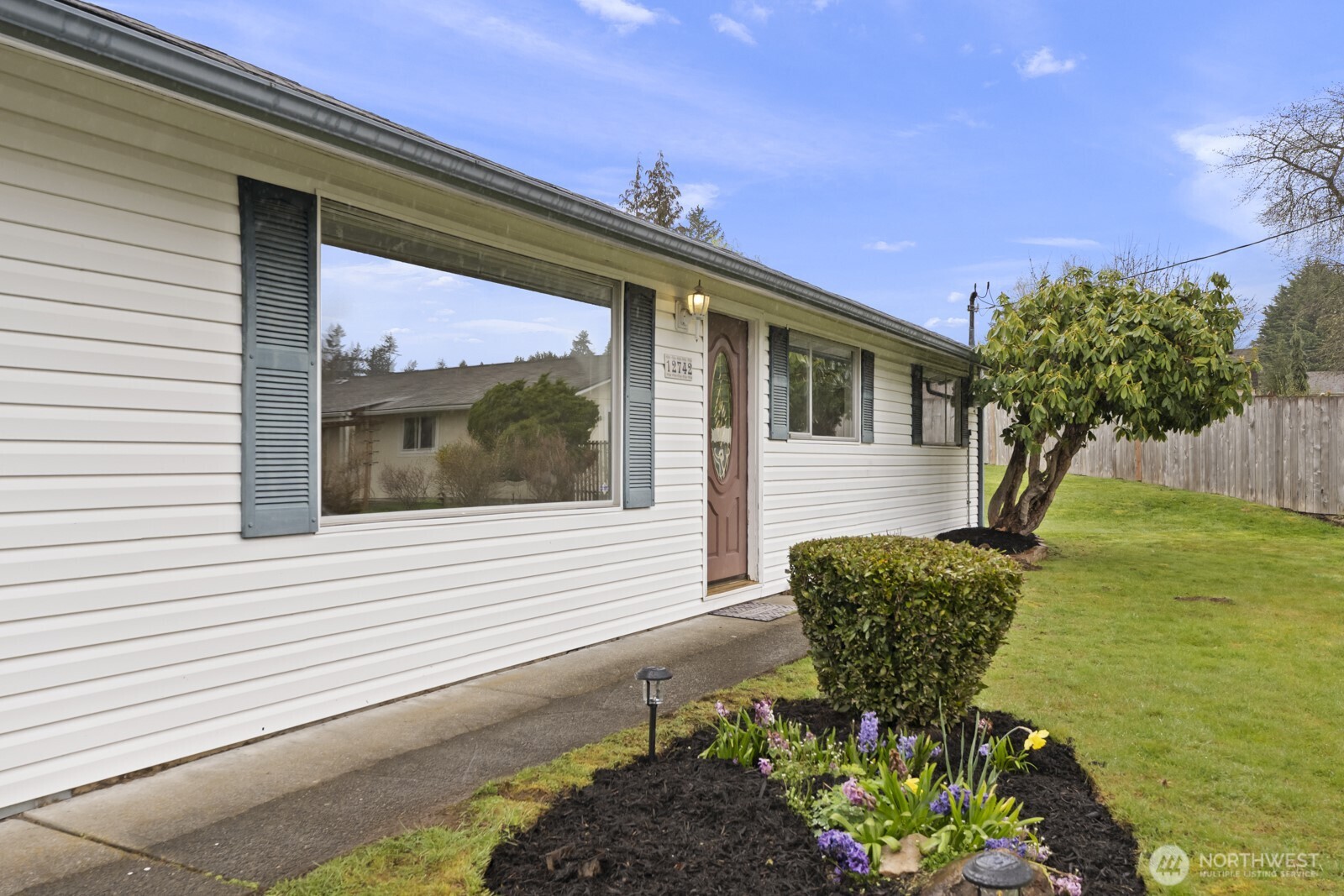 12742 Southeast 171st Place Renton, WA 98058 - Photo 27 of 33 a front view of a house with a yard