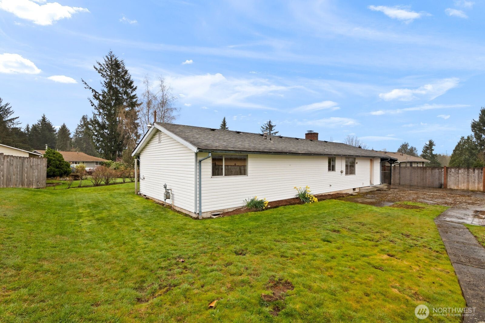 12742 Southeast 171st Place Renton, WA 98058 - Photo 30 of 33 a view of a backyard with plants and a garden