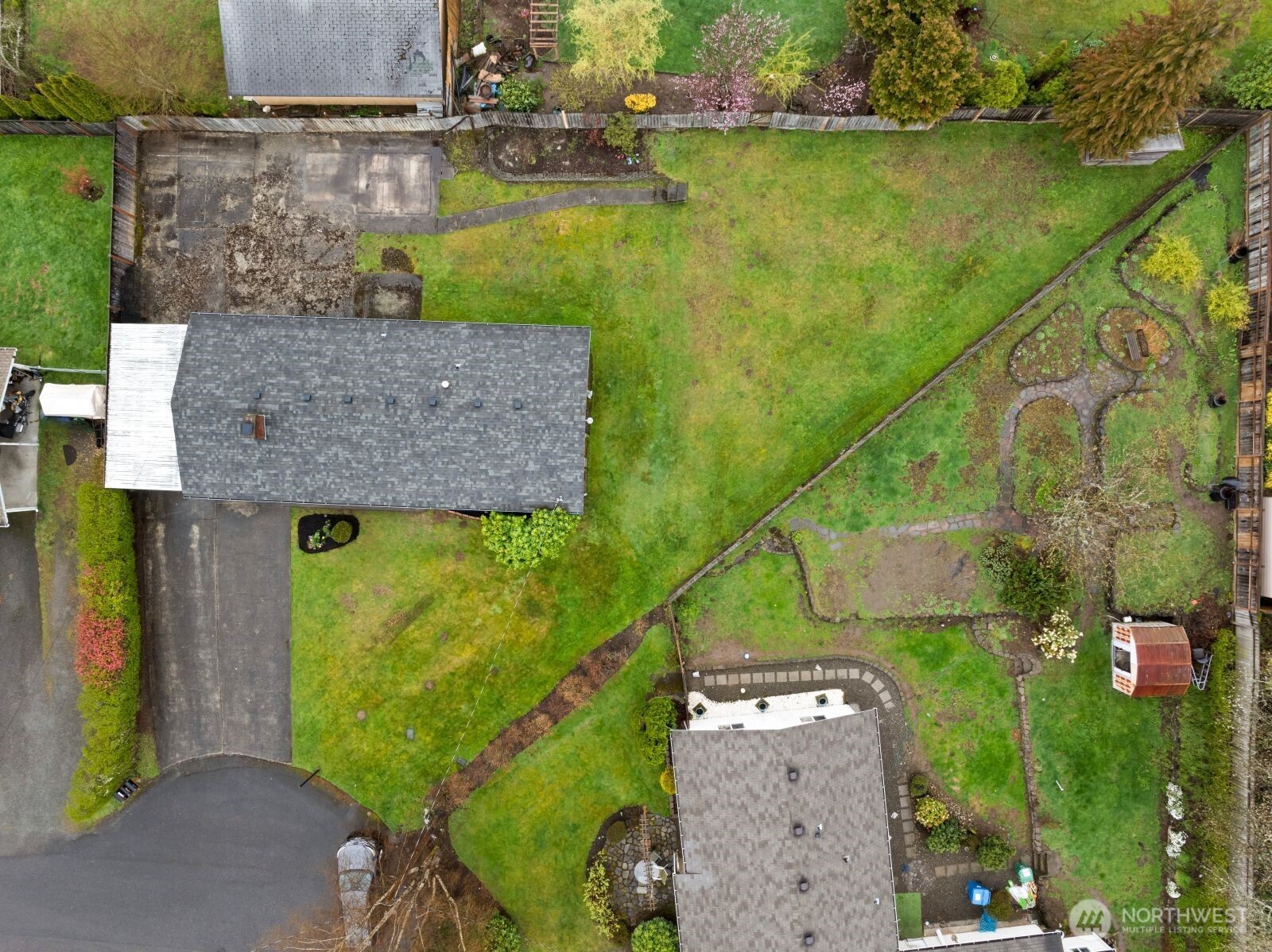 12742 Southeast 171st Place Renton, WA 98058 - Photo 31 of 33 an aerial view of a house with a yard and lake view