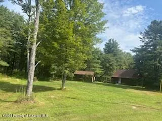 a view of swimming pool from a yard