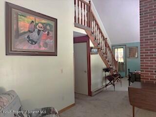 1087 Canada Road Friendsville, PA 18818 - Photo 21 of 72 a view of staircase with furniture and a chandelier