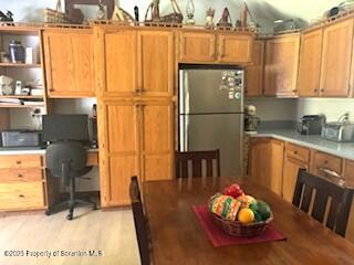 1087 Canada Road Friendsville, PA 18818 - Photo 31 of 72 a kitchen with stainless steel appliances granite countertop a refrigerator a sink a dining table and chairs with wooden floor