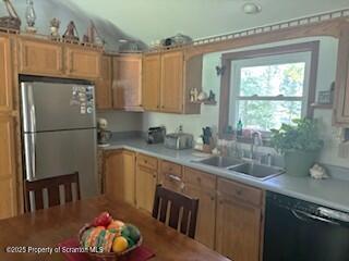 1087 Canada Road Friendsville, PA 18818 - Photo 32 of 72 a kitchen with stainless steel appliances granite countertop a refrigerator and a sink