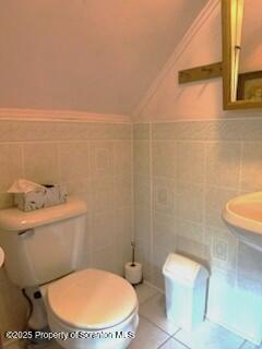 1087 Canada Road Friendsville, PA 18818 - Photo 44 of 72 a white toilet sitting next to a bathroom sink