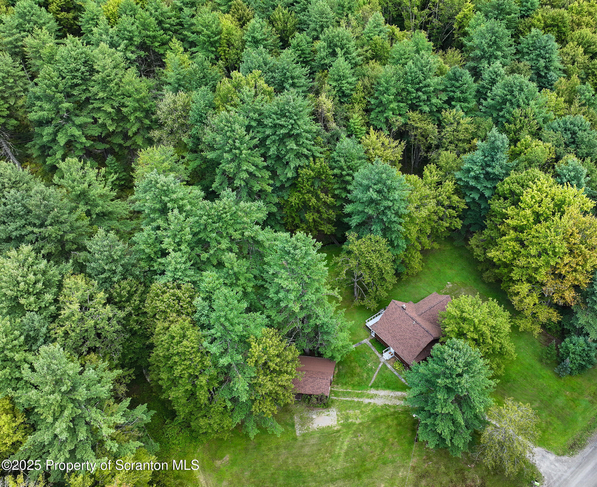 1087 Canada Road Friendsville, PA 18818 - Photo 59 of 72 an aerial view of a house with swimming pool and garden
