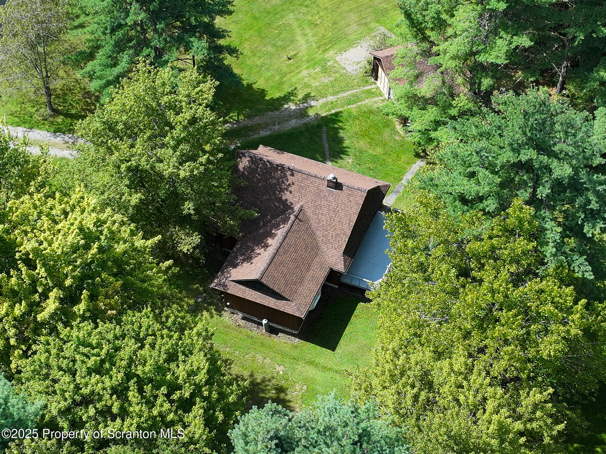 1087 Canada Road Friendsville, PA 18818 - Photo 70 of 72 an aerial view of a house with a yard