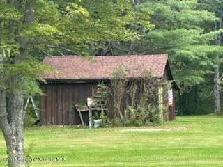 1087 Canada Road Friendsville, PA 18818 - Photo 9 of 72 a view of a dinning table and chairs in the garden