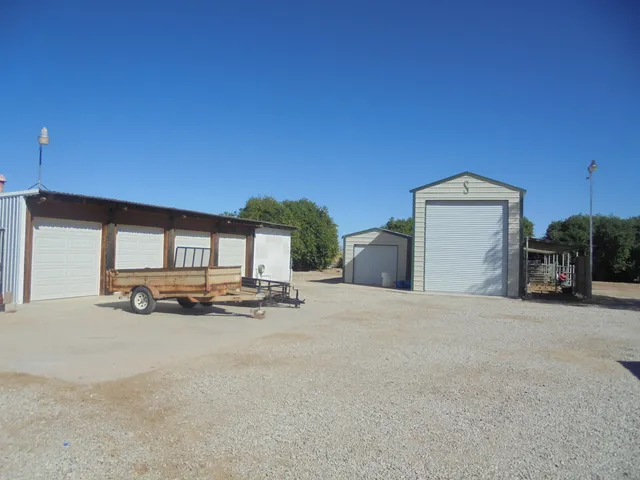 a view of a livingroom with furniture and a garage