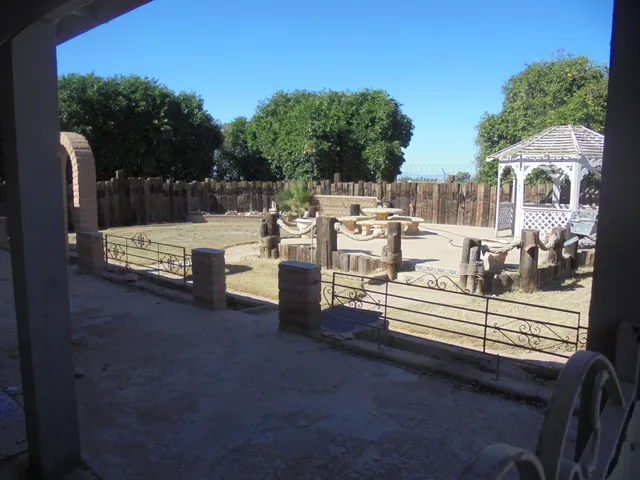 a view of a deck with couches table and chairs and potted plants