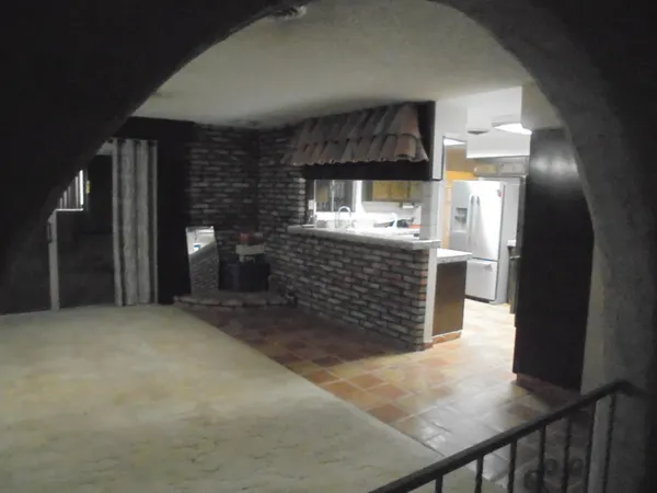 a view of an empty room with a fireplace
