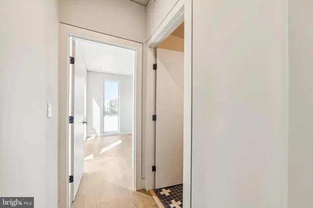 a view of a bathroom from a hallway