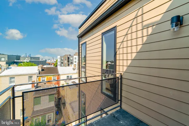 a view of a balcony with chairs