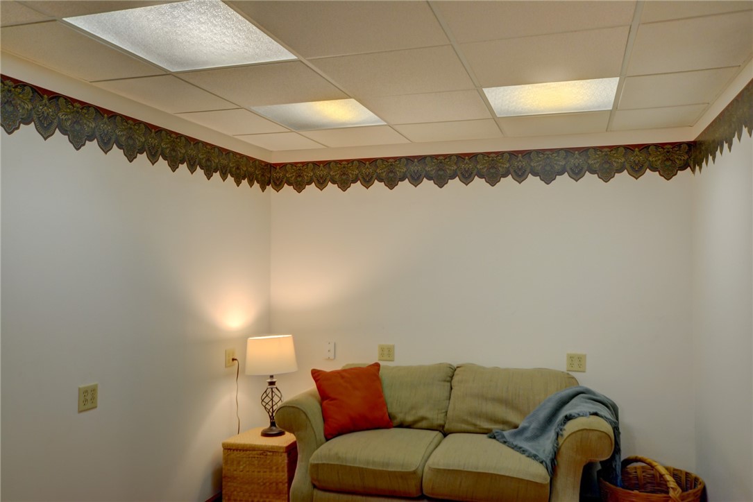 4095 West Rock Springs Road Decatur, IL 62522 - Photo 21 of 48 a living room with a couch