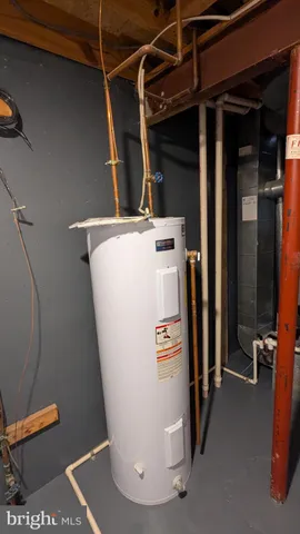 a view of a storage & utility room with two washing machine